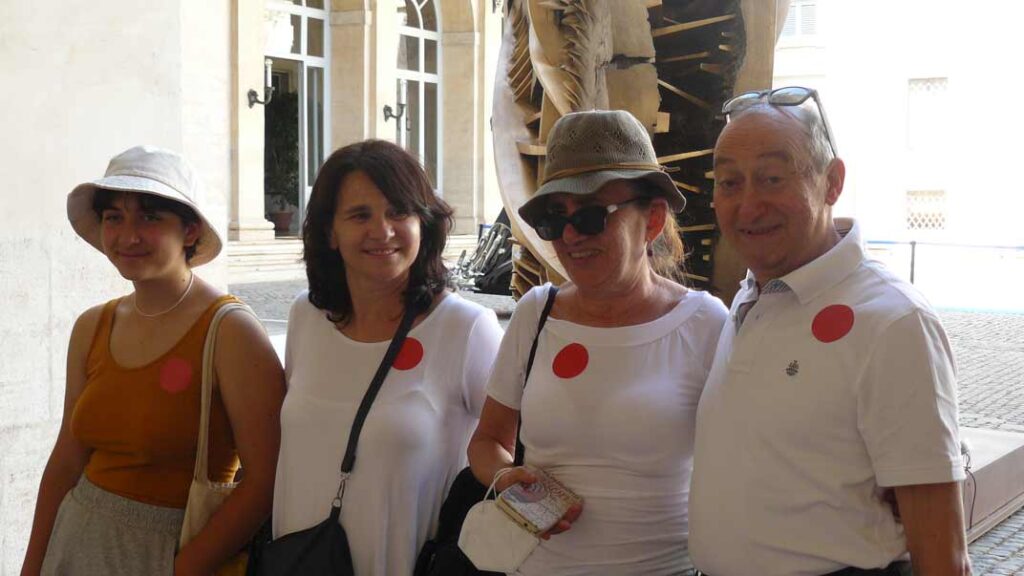 Group of four people smiling