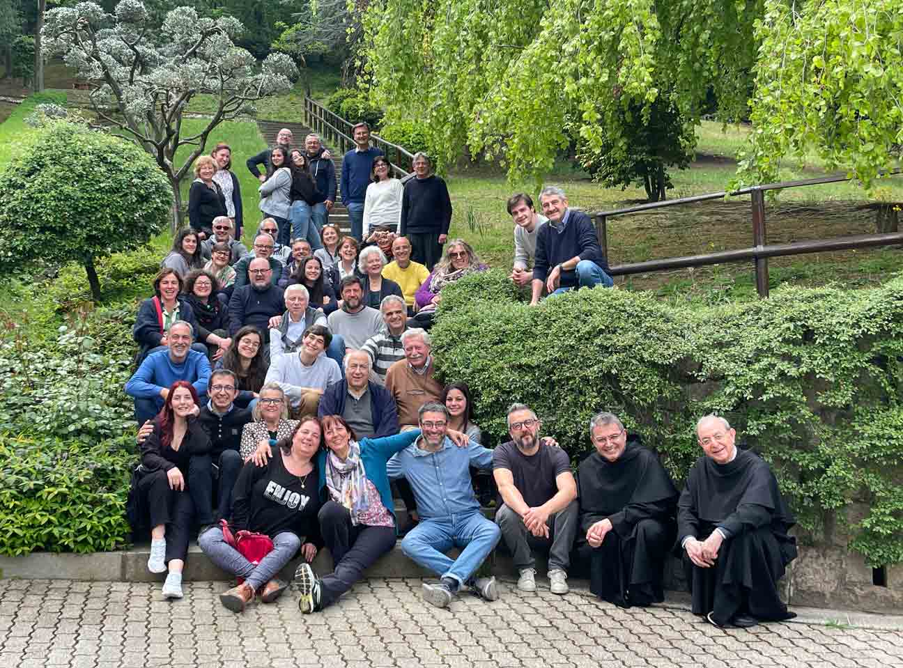 Group of people posing on a park staircase